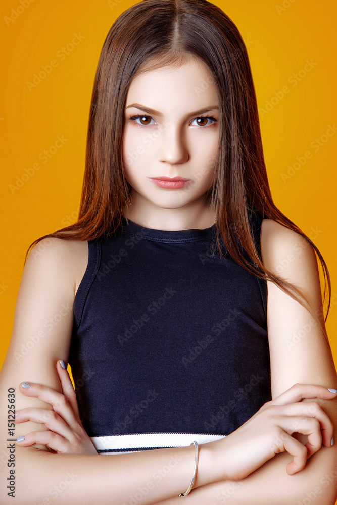 Cute girl teenage with long hair posing studio nature portrait. Cute girl teenage with long hair posing studio nature portrait.