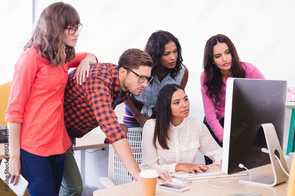 Business people working over desktop computer Business people working over desktop computer