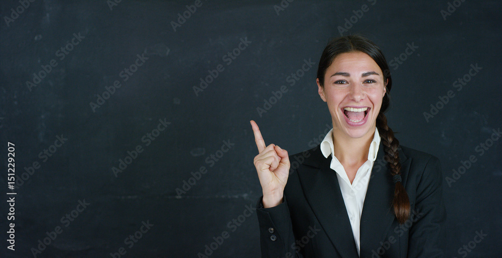 Portrait of a beautiful business girl, a marketing teacher, thinking about new ideas and strategies, on a black background. Concept: career growth, growth chart, successful girl, marketing, ideas. Portrait of a beautiful business girl, a marketing teacher, thinking about new ideas and strategies, on a black background. Concept: career growth, growth chart, successful girl, marketing, ideas.
