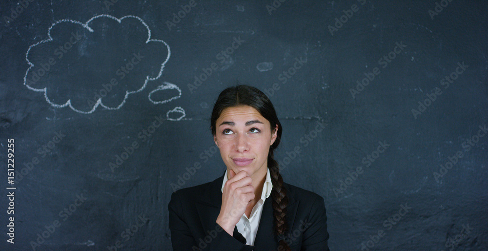 Portrait of a beautiful business girl, a marketing teacher, thinking about new ideas and strategies, on a black background. Concept: career growth, growth chart, successful girl, marketing, ideas. Portrait of a beautiful business girl, a marketing teacher, thinking about new ideas and strategies, on a black background. Concept: career growth, growth chart, successful girl, marketing, ideas.