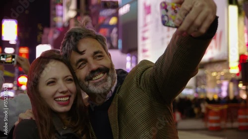 Couple taking selfie in Times Square, New York City