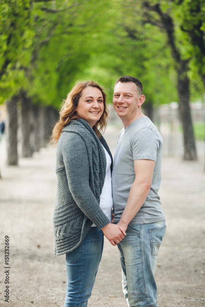 Happy loving couple outdoors in a park