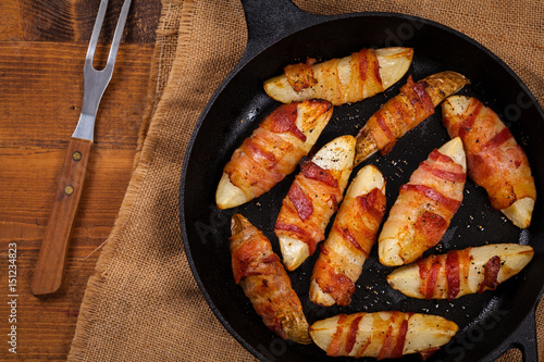 Bacon Wrapped Potatoes Wedges. Selective focus. photo