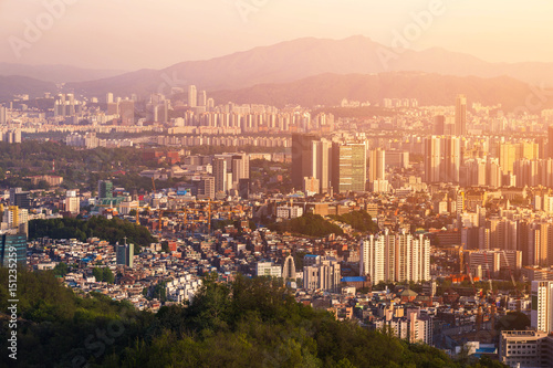 Seoul City skyline with downtown skyscrapers at sunset.