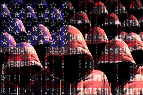 Group of hooded hackers shining through a digital american flag