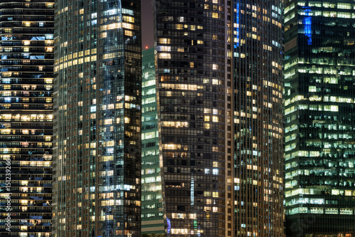 Amazing glowing windows of skyscrapers at evening © efired