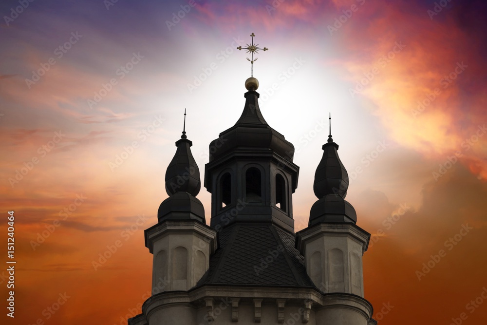 Church against the background of the sky.Sunset sky . Faith in God. colourful sky. Golden ratio . architecture of antiquity . God's Cross