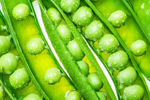 Peas in pods green vegetables background. 