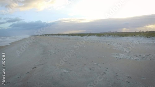 Aerial hovering shot of dunes and shore Masonboro Island beach photo