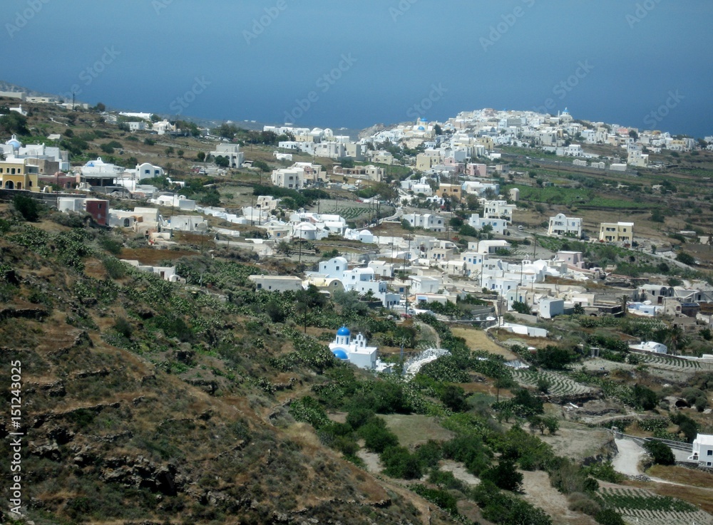 Steep slopes of Santorini/Beautiful resort among the Cyclades in the Aegean sea, Greece. Typical white and blue architecture