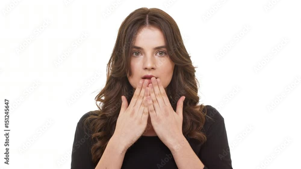 Attractive brunette Caucasian female crying out in surprise standing on white background Attractive brunette Caucasian female crying out in surprise standing on white background