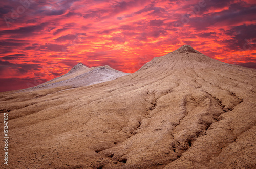 Sunset over muddy volcanoes, Buzau county, Romania. Active mud volcanoes landscape in Europe. © Lucian Bolca