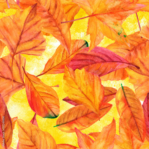 Seamless pattern with vibrant watercolor leaves on golden yellow