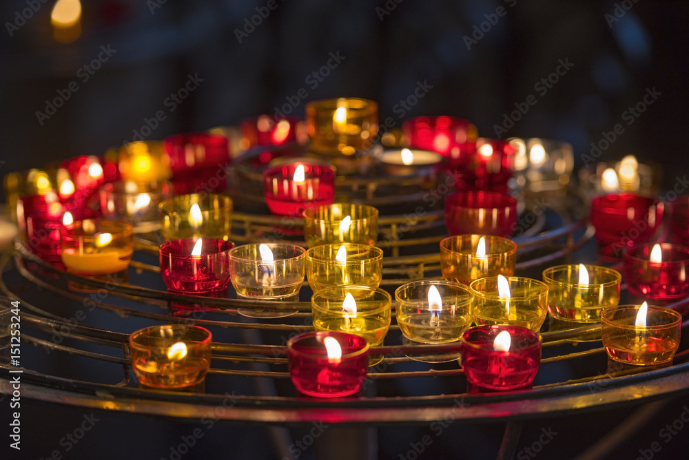 Fototapeta Burning candles in a church