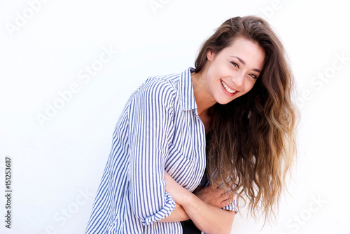 smiling young woman against white background