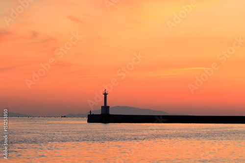 Sunset, Lighthouse and Angler