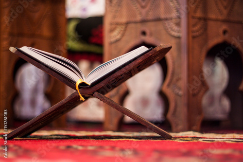 Quran-holy book of Muslims, an open book on a stand with rosary