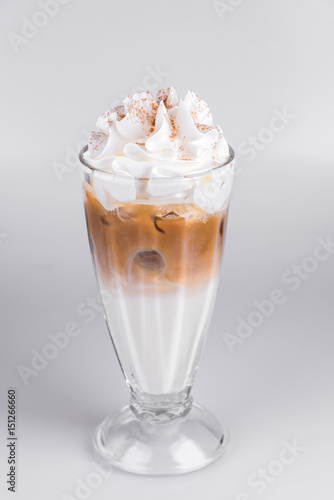 Latte with whipped cream on isolated white background