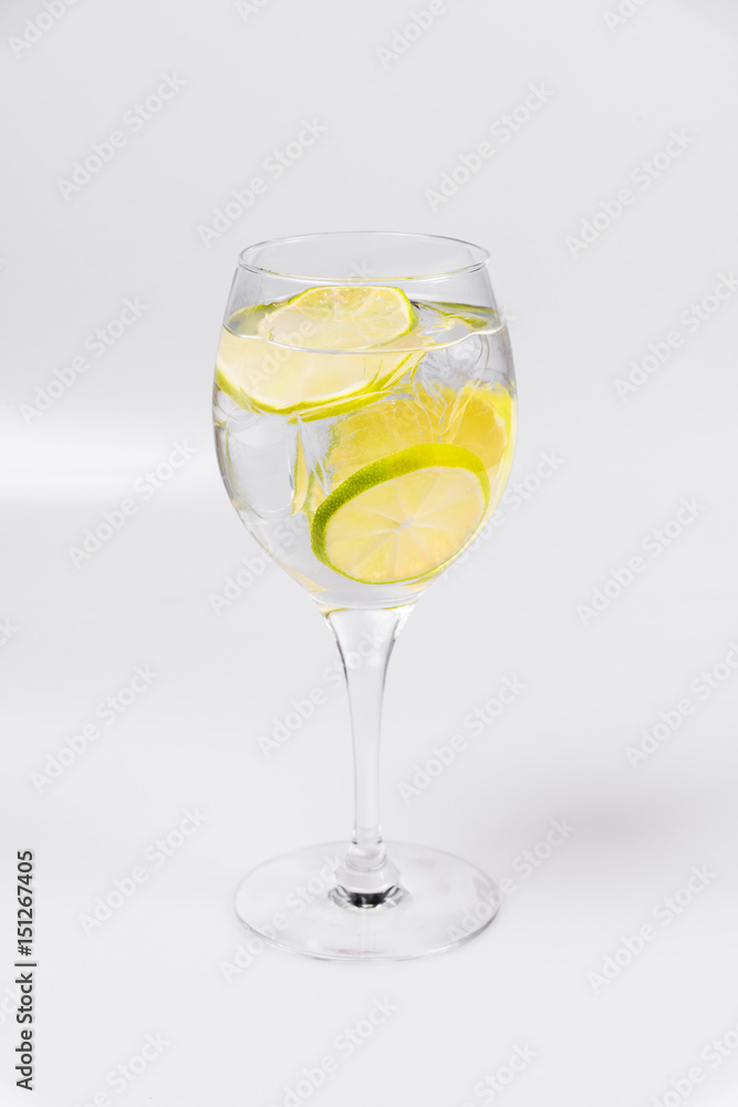 Water with lemon on isolated white background Water with lemon on isolated white background