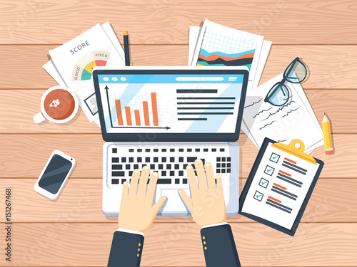 Businessman working on laptop. Hands on laptop and computer mouse, documents, forms, notebook, coffee, notes, pen.