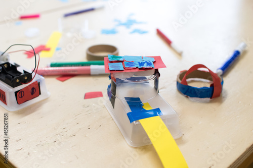 Construction of children's robots. Colored boxes with paper strips, inventions and creativity for children. Trash Robots, Tinkering and making, educational activities for schools and children