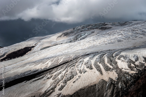 Melting glacier on Mt. Elbrus slope photo