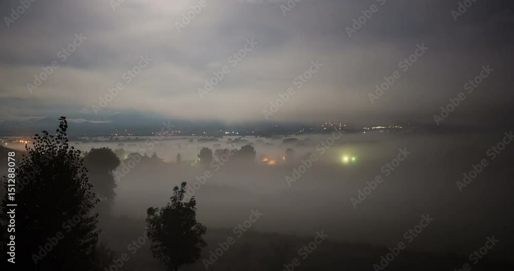 Fog moving through field at midnight Fog moving through field at midnight