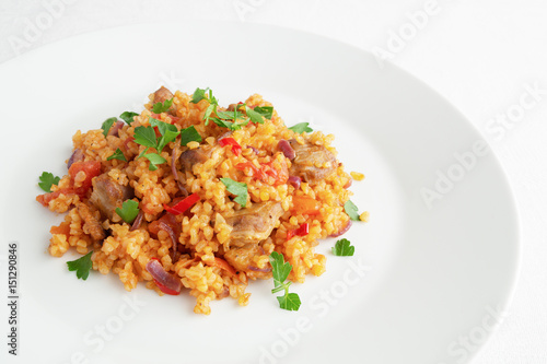 wheat with mutton pieces, cooked with onion, pepper, and tomato