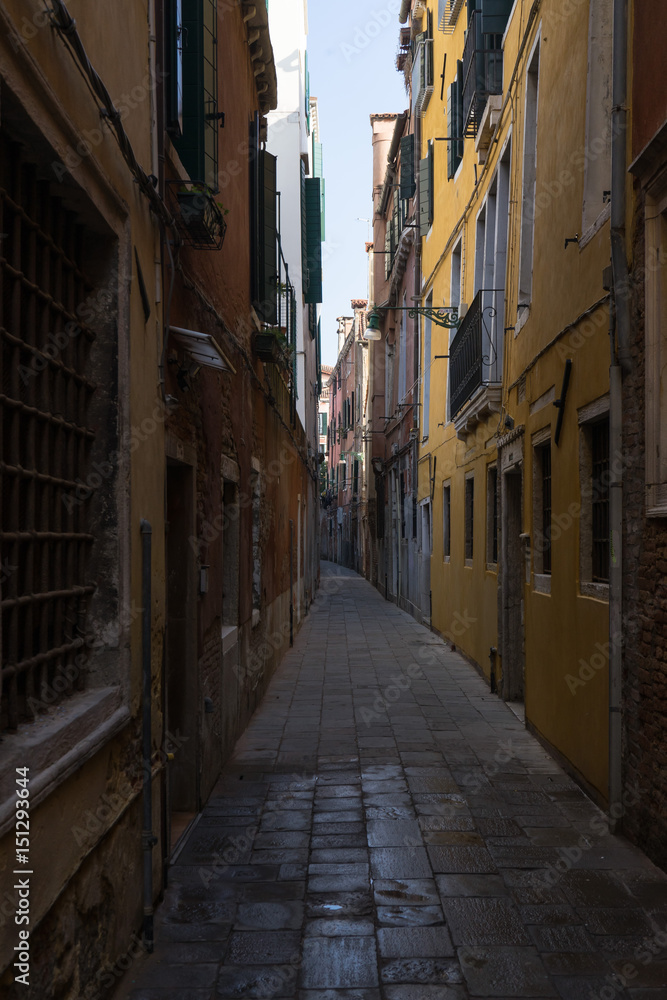 A narrow venetian alley in Venice, Italy