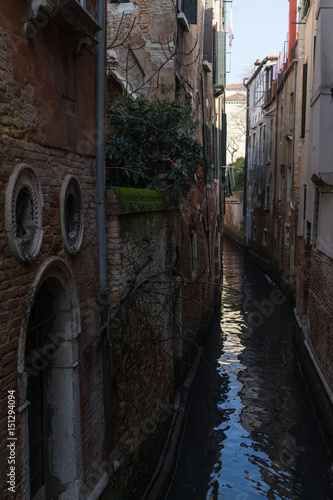 A small typical canal in Venice, Italy