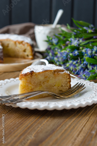 Apple vegan pie with coffee and snowdrops