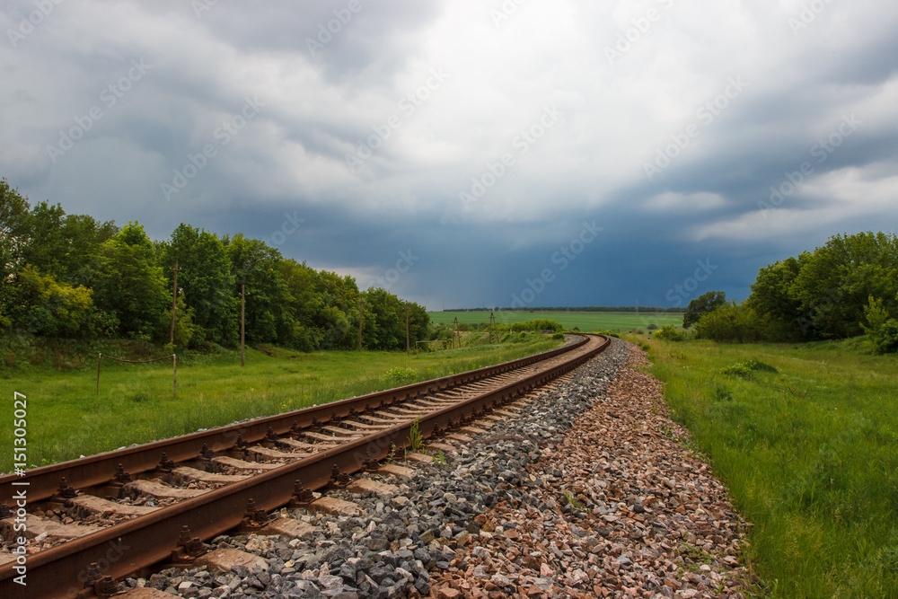 Rails. nature. overcast sky