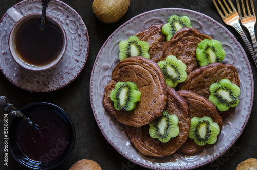 Chocolate pancakes with vegan with kiwi for breakfast