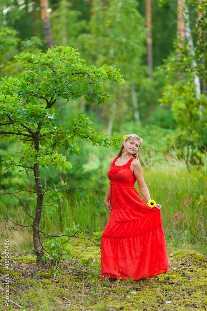 Young pretty blonde posing in summer