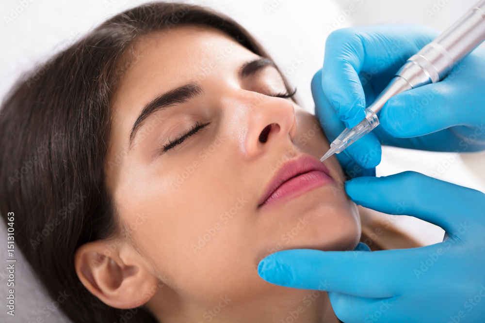 Cosmetologist Applying Permanent Make Up On Lips Cosmetologist Applying Permanent Make Up On Lips