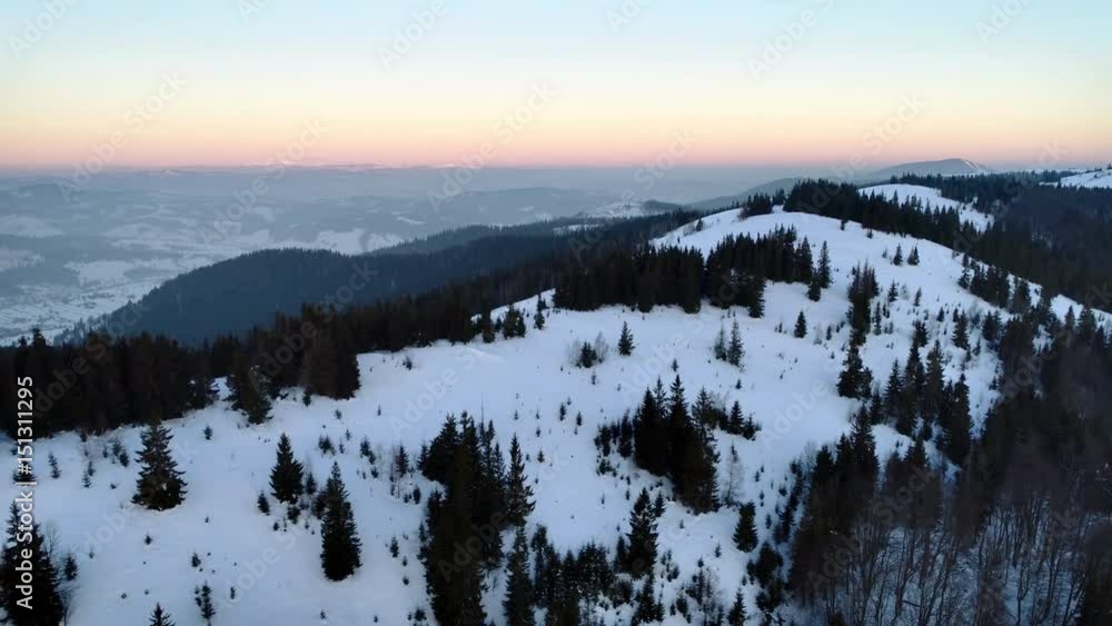 Aerial view in sunrise winter mountain Aerial view in sunrise winter mountain