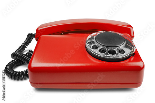 Landline red phone on isolated background with a shadow photo