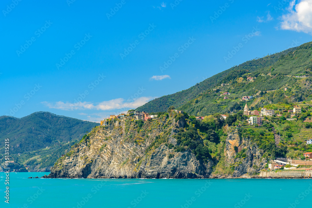 Scenic view of the mediterrean sea and a town inside the Cinque Terre National Park, Liguria, Italy from the cliffs near Manarola.