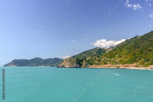 Scenic view of the mediterrean sea and a town inside the Cinque Terre National Park, Liguria, Italy from the cliffs near Manarola.