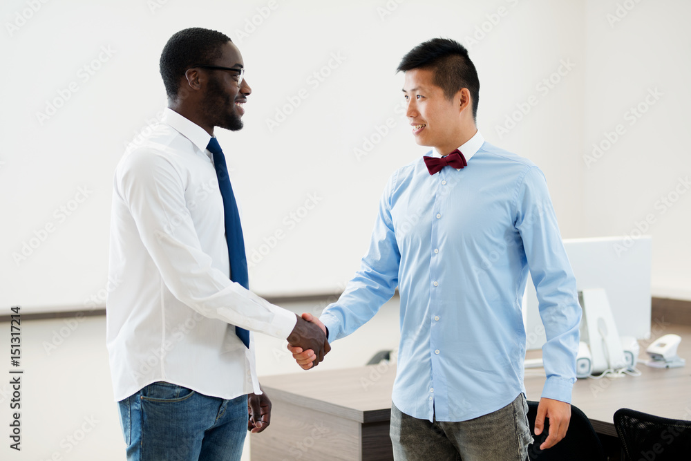 Manager congratulating employee on a job well done