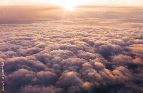 Vanilla clouds at sunset from plane window