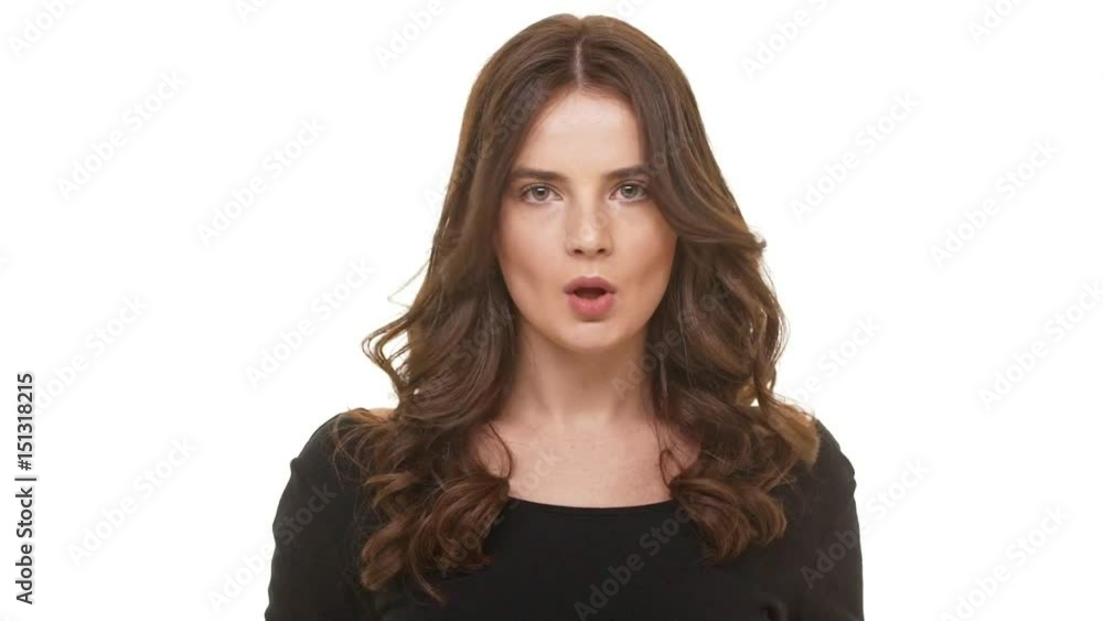 Young Caucasian brunette female actively arguing looking at camera and wagging her finger in slowmotion. Footage on white background Young Caucasian brunette female actively arguing looking at camera and wagging her finger in slowmotion. Footage on white background