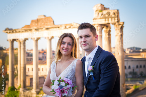 Bride and groom wedding poses in front of Roman Forum, Rome, Italy © daliu