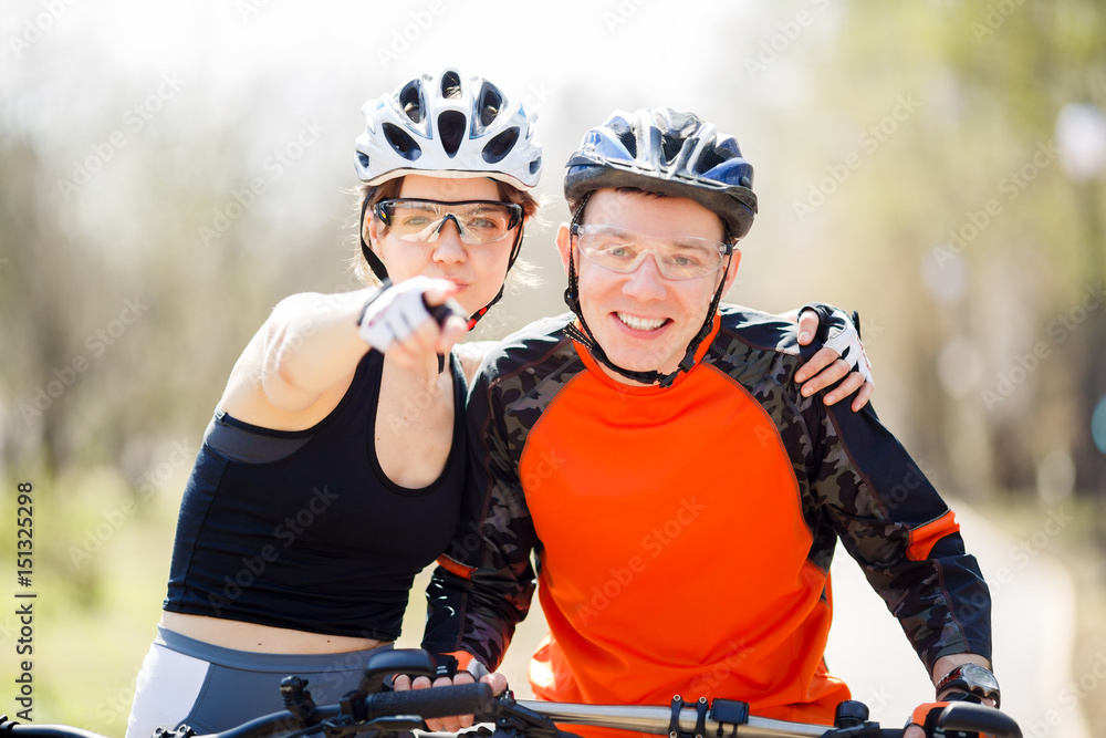 Portrait of couple on bicycles Portrait of couple on bicycles