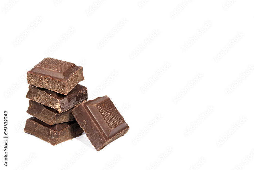 Closed up stack of Dark Chocolate Cubes Isolated on White Background with Free Space for Text and Design Closed up stack of Dark Chocolate Cubes Isolated on White Background with Free Space for Text and Design