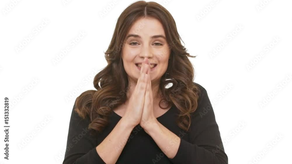 Joyful Caucasian female with long brunette hair happily saying wow on white background and smiling in slowmotion Joyful Caucasian female with long brunette hair happily saying wow on white background and smiling in slowmotion