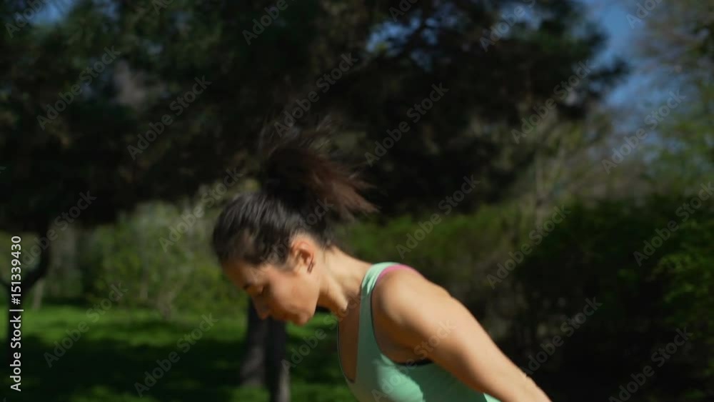 Young beautiful woman stretching on the yellow carpet in the forest slow motion Young beautiful woman stretching on the yellow carpet in the forest slow motion