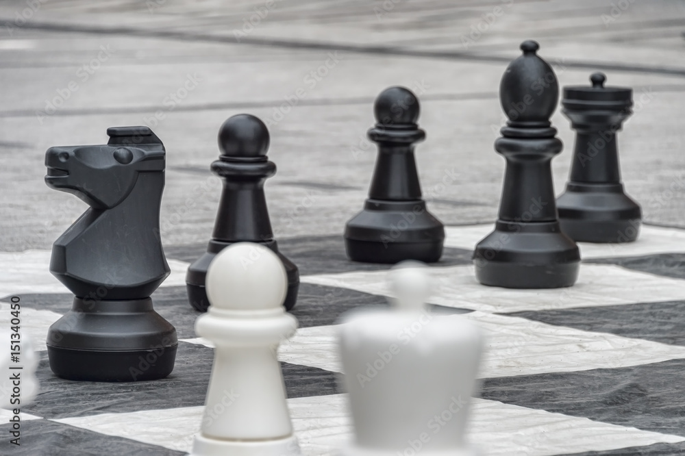 Life size chess pieces and giant chess board