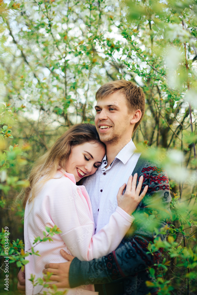 Romantic happy loving couple on nature in spring Romantic happy loving couple on nature in spring