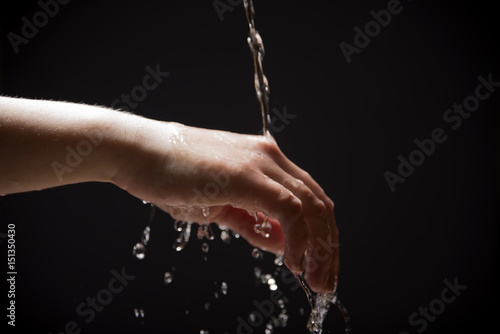 Water drains from the hands